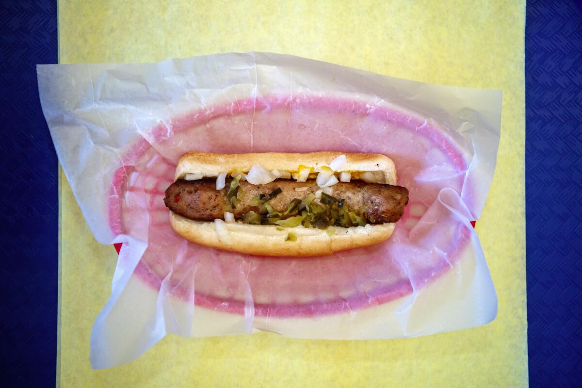 Chicken sausage link on a bun from Mama's Chicken and Market.