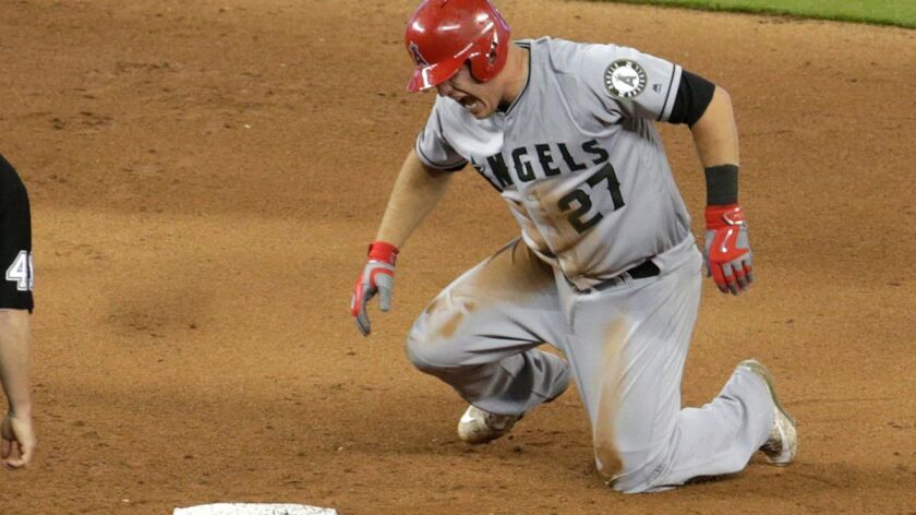 The Angels' Mike Trout reacts after suffering an injury to his left thumb on a steal of second base in the fifth inning against the Miami Marlins on May 28.