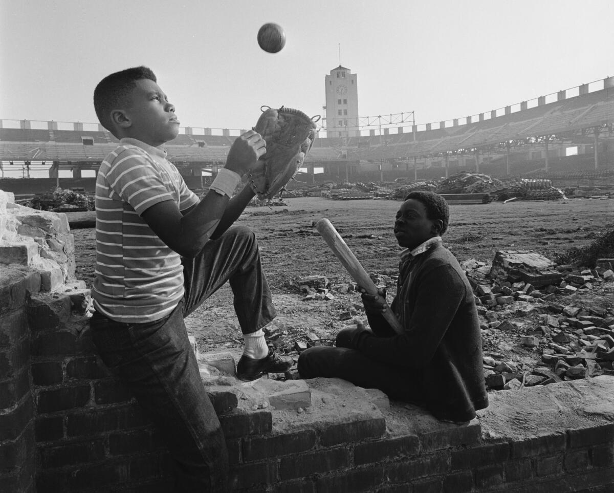 Kids play at the original Wrigley Field in Los Angeles, during the days it was being dismantled in March 1969.