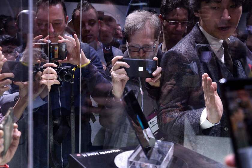 Visitors take images of Huawei's new foldable 5G smartphone HUAWEI Mate X at the Mobile World Congress (MWC), on the eve of the world's biggest mobile fair, on February 24, 2019 in Barcelona. - Phone makers will focus on foldable screens and the introduction of blazing fast 5G wireless networks at the world's biggest mobile fair starting tomorrow in Spain as they try to reverse a decline in sales of smartphones. (Photo by Josep LAGO / AFP)JOSEP LAGO/AFP/Getty Images ** OUTS - ELSENT, FPG, CM - OUTS * NM, PH, VA if sourced by CT, LA or MoD **
