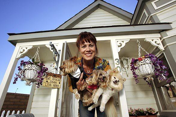 Buy your dog a mansion! Doghouse, shmog-house. If the pooches have to spend time outside, make like Riverside resident Tammy Kassis did and buy them a Victorian mansion. See more photos here.