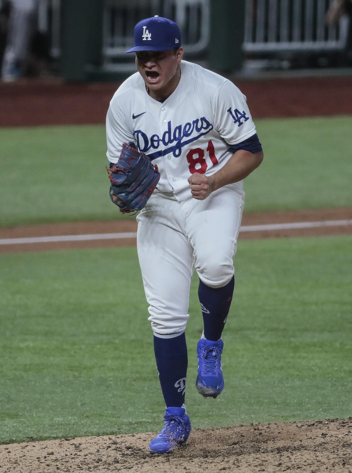 Dodgers reliever Victor Gonzalez celebrates after striking out Atlanta's Charlie Culberson.