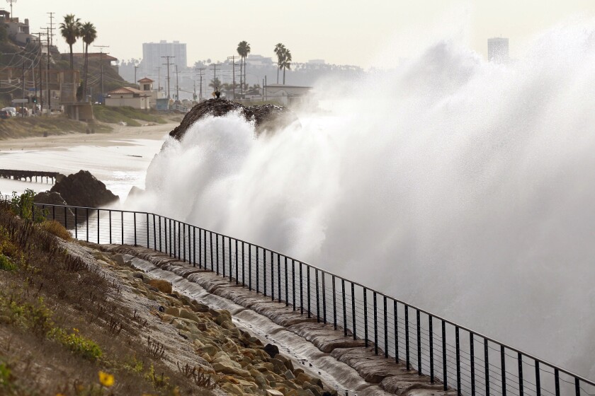 High surf crashes into the sea wall near Big rock on Will Rogers State Beach along Pacific Coast Highway in Pacific Palisades. Unusually high tides, fueled by high surf and a full moon, began hitting Southern California on Tuesday.