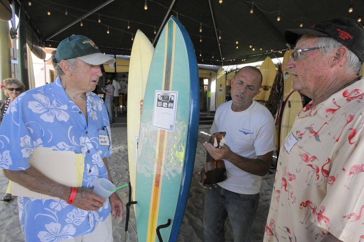 Larry Gordon, left, chats with Eric Huffman and Tom Morey at Gordon & Smith's 50th anniversary event in 2009.