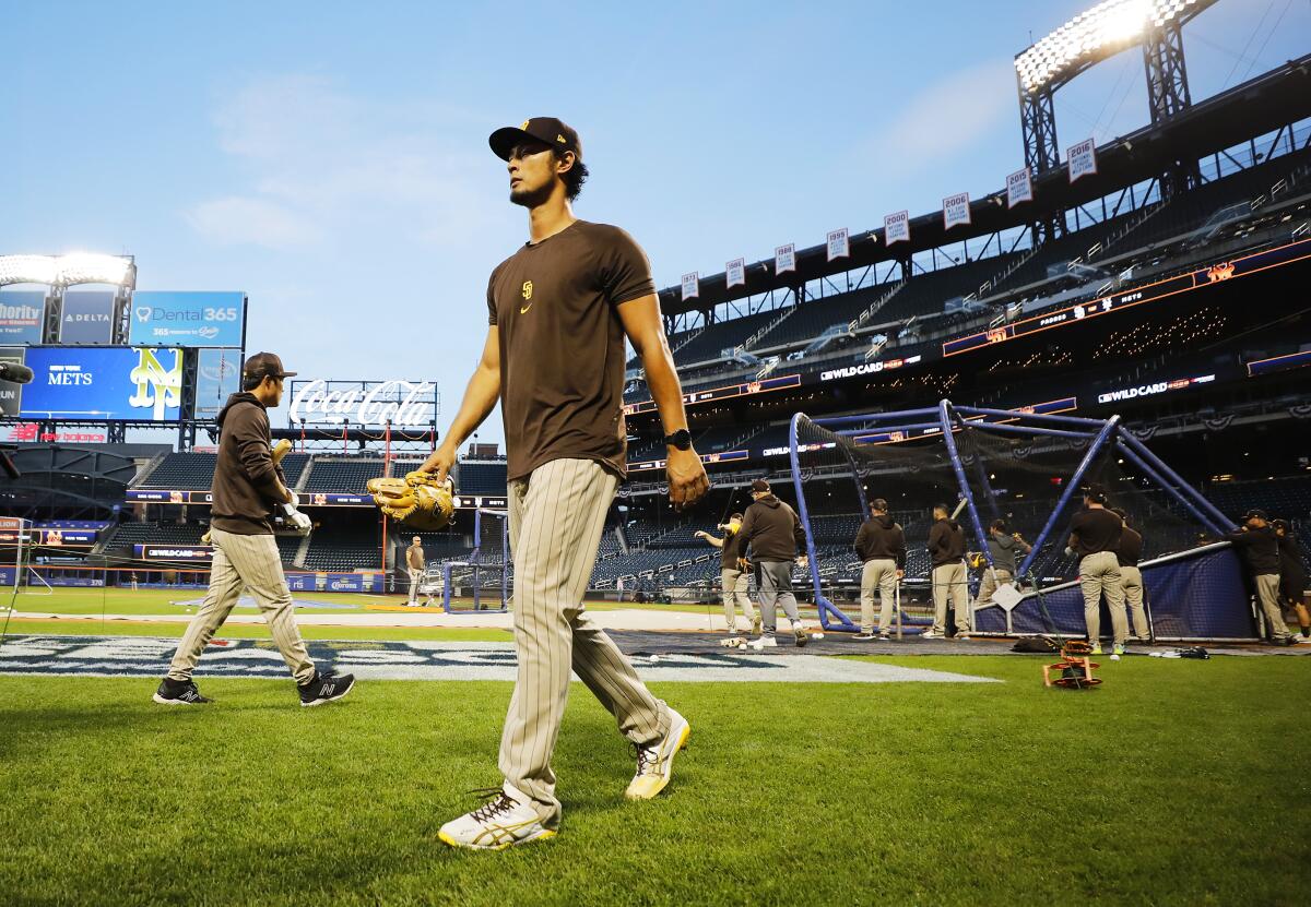 Padres pitcher Yu Darvish walks off the field after a workout at Citi Field
