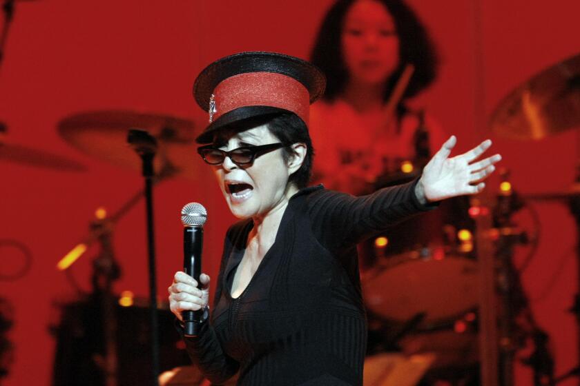 Yoko Ono performing in 2010 with the Plastic Ono Band at the Orpheum Theatre in Los Angeles.