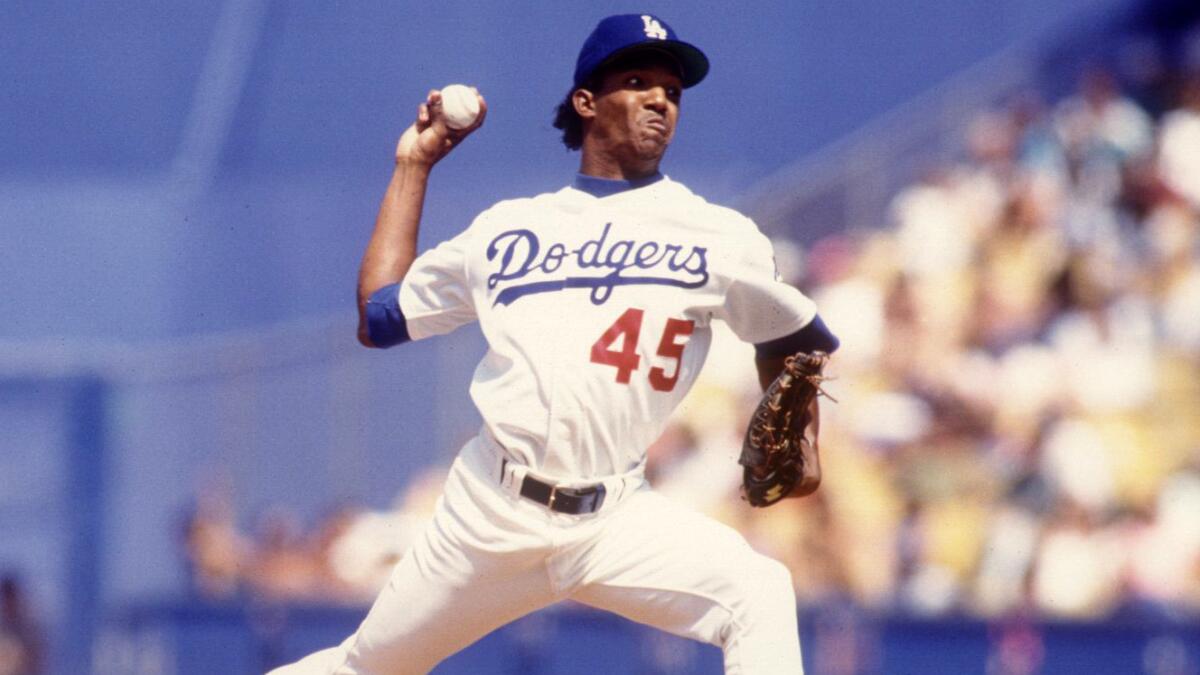 Dodgers pitcher Pedro Martinez delivers during a game against the San Diego Padres in August 1993. Martinez has been elected to the Baseball Hall of Fame.