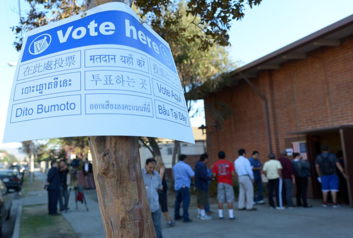 Sun Valley residents wait in line to vote at the polling station located at Our Lady of The Holy Church on election day at the Sun Valley's Latino district, Los Angeles County, on Nov. 6, 2012 in California.