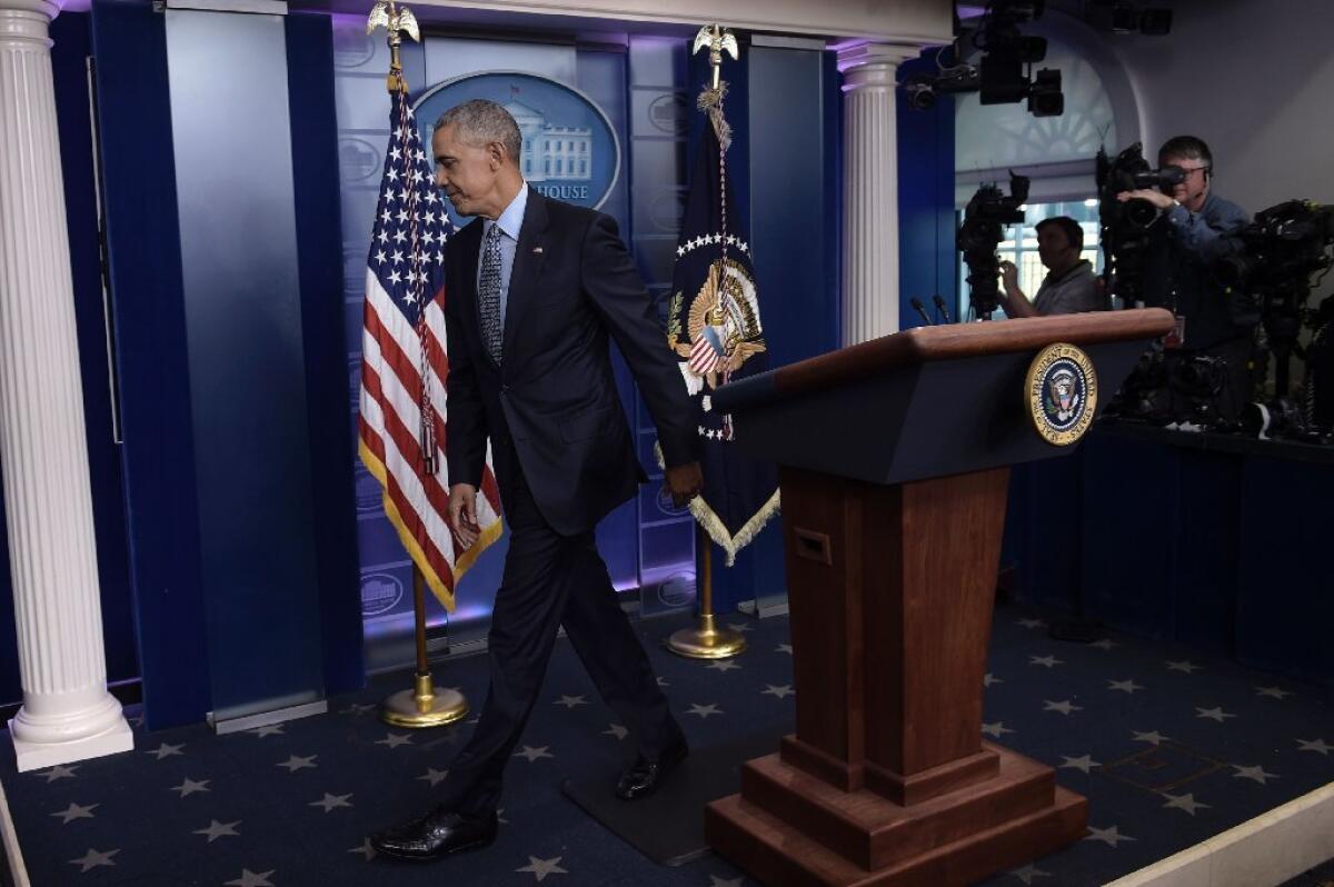 President Obama leaves the White House briefing room after his final news conference on Wednesday.