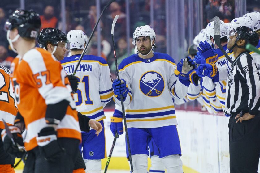 Buffalo Sabres' Alex Tuch, center, celebrates his goal against the Philadelphia Flyers with teammates during the second period of an NHL hockey game Saturday, April 1, 2023, in Philadelphia. (AP Photo/Chris Szagola)