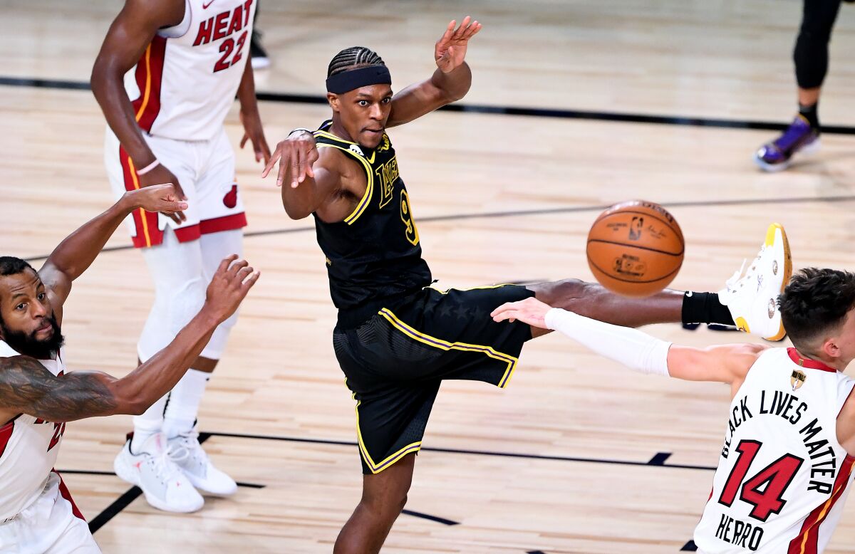Lakers guard Rajon Rondo passes during the fourth quarter of a 124-114 victory over the Miami Heat.