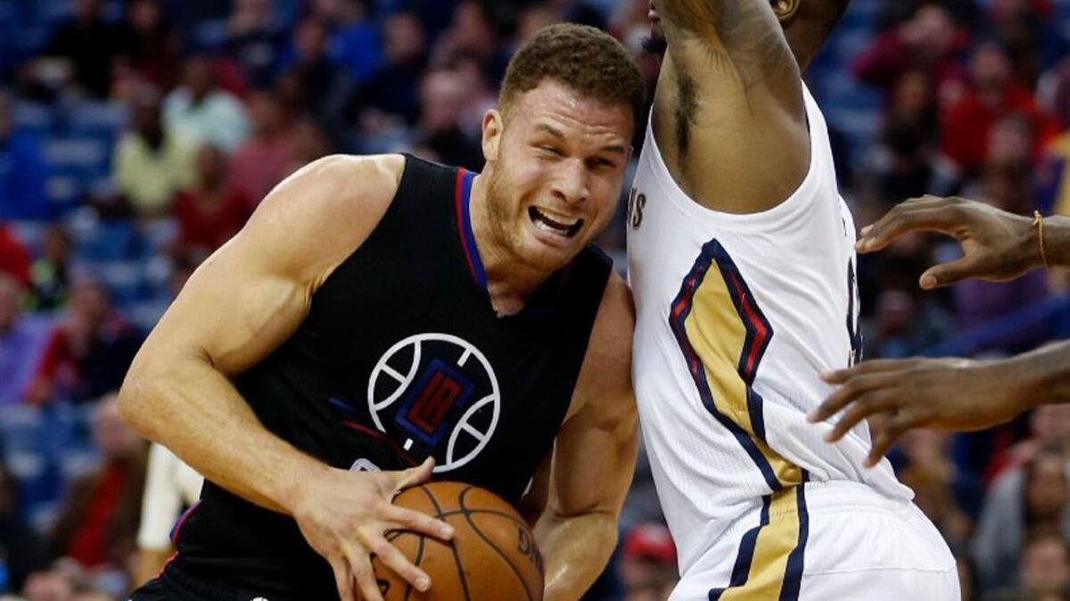 Clippers forward Blake Griffin drives to the basket against Pelicans forward Terrence Jones during the first half of a game on Dec. 2.