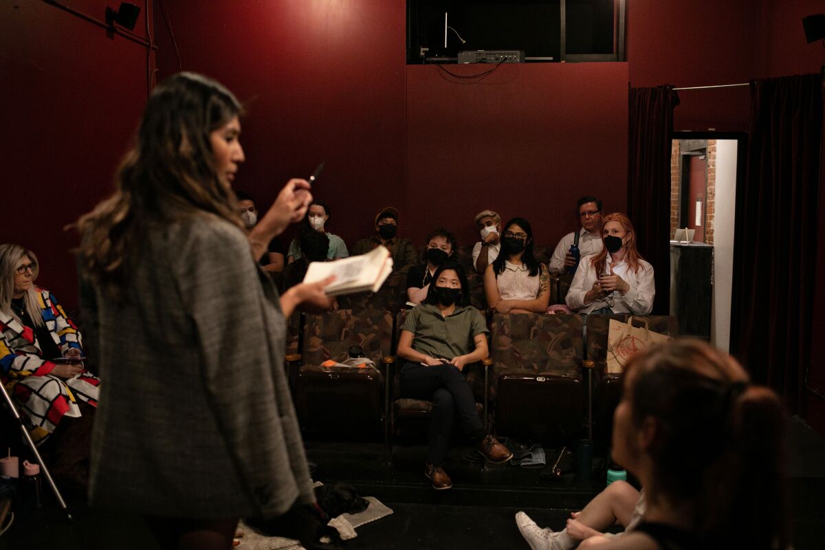 A teacher leads an acting class.