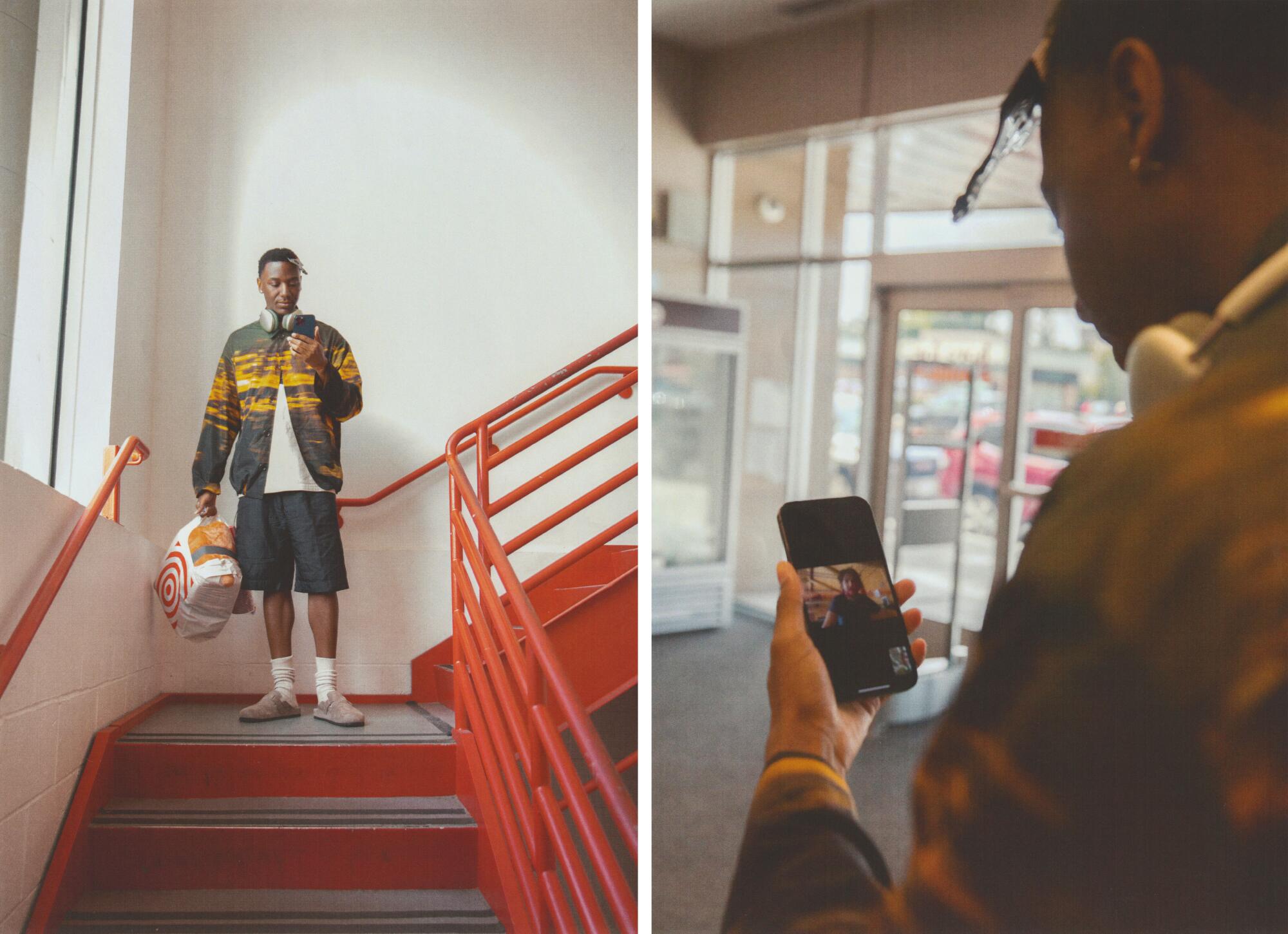 A man stands on a staircase looking at his phone