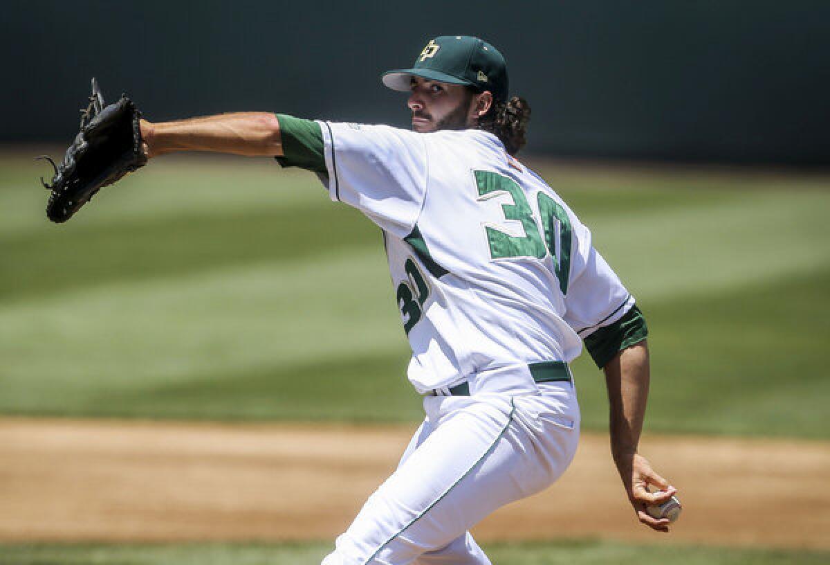 Cal Poly pitcher Joey Wagman throws to the plate during the first inning of Friday's game against San Diego.