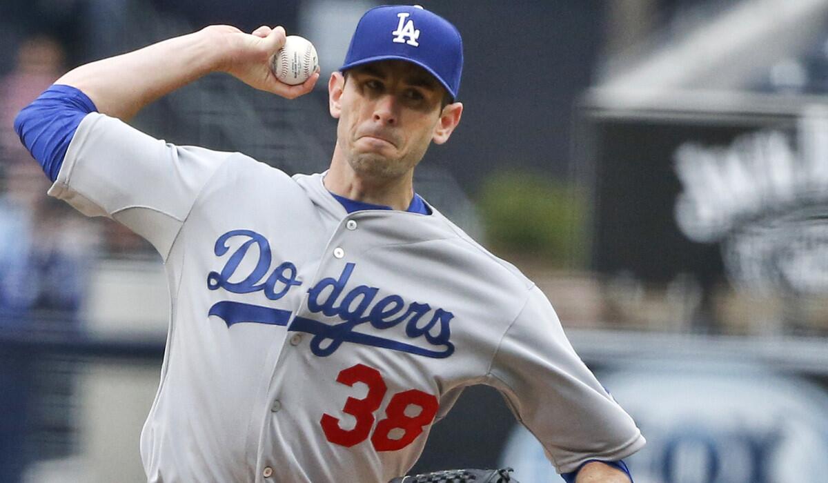 Los Angeles Dodgers starting pitcher Brandon McCarthy pitches against the San Diego Padres on Saturday. McCarthy walked off the mound during the sixth inning due to tightness on his right elbow.