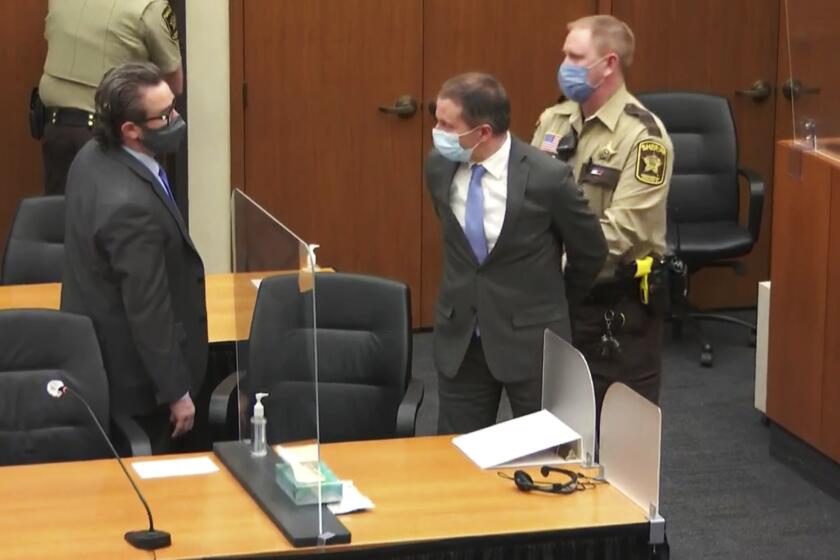 FILE - In this April 20, 2021 file image from video, former Minneapolis police Officer Derek Chauvin, center, is taken into custody as his attorney, Eric Nelson, left, looks on, after the verdicts were read at Chauvin's trial for the 2020 death of George Floyd, at the Hennepin County Courthouse in Minneapolis, Minn. Chauvin, convicted of murder in the death of Floyd is scheduled to make his initial appearance via videoconference, Tuesday, June 1, 2021, on federal charges that he violated Floyd's civil rights when he placed his knee on the Black man's neck, pinning him to the street. (Court TV via AP, Pool, File)