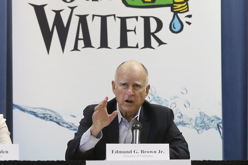 Gov. Jerry Brown responds to a question after a meeting with businesses affected by the drought at his Capitol office in Sacramento, Calif., Thursday, April 16, 2015. Cities expected to slash water use in the drought are revolting against Brown’s mandatory water restrictions, and dozens of agencies are telling water regulators that their assigned water use targets are unrealistic and unfair. (AP Photo/Rich Pedroncelli)
