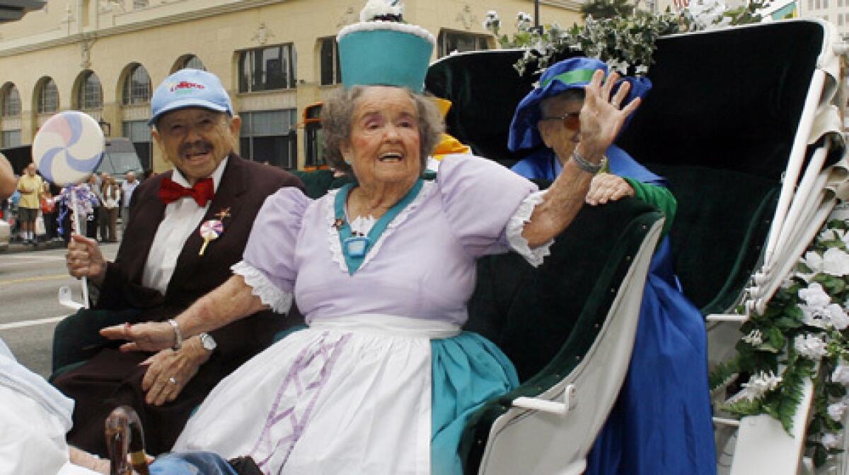 The Munchkins from "The Wizard of Oz" arrive in a carriage to receive a star on the Hollywood Walk of Fame. From left, Jerry Maren, Margaret Pelligrini and Meinhardt Raabe.