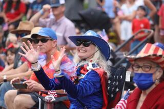 HUNTINGTON BEACH, CA - JULY 04: Elizabeth McLeod, of Huntington Beach, at the Huntington Beach Fourth of July Parade along Main Street in downtown on Monday, July 4, 2022 in Huntington Beach, CA. (Gary Coronado / Los Angeles Times)