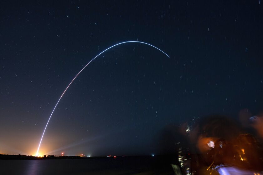 Spectators at Jetty Park in Cape Canaveral, Fla., watch as Terran I, a 3D-printed rocket by Relativity Space, lifts off from Cape Canaveral Space Force Station late Wednesday, March 22, 2023. (Craig Bailey/Florida Today via AP)
