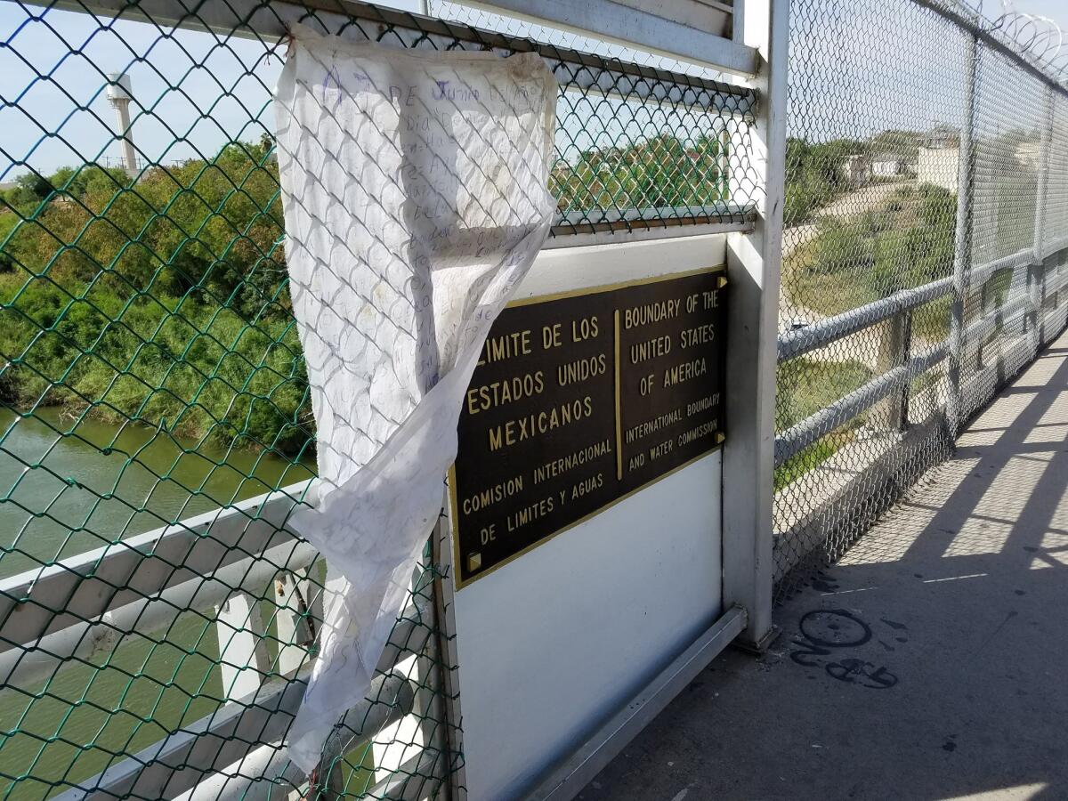 Boundary marker on the bridge between Ciudad Miguel Aleman and Roma, Texas.