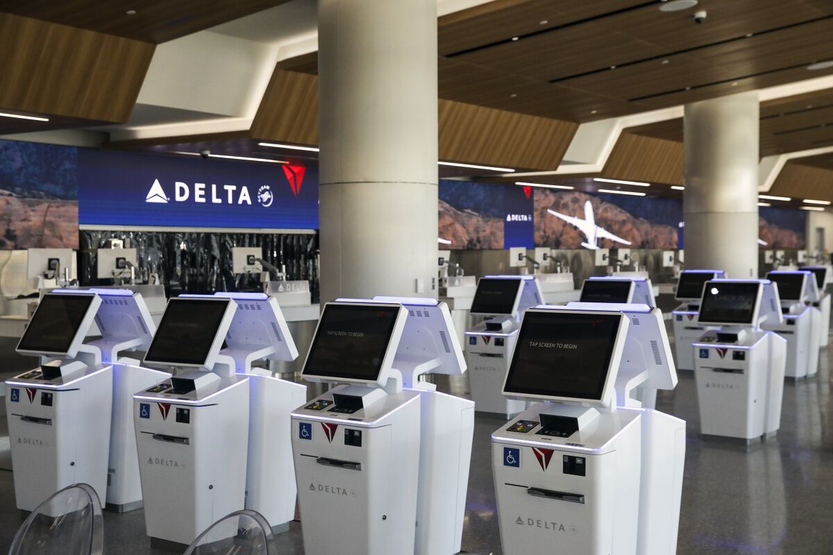 Rows of standing computer stations in Delta's new terminal at LAX