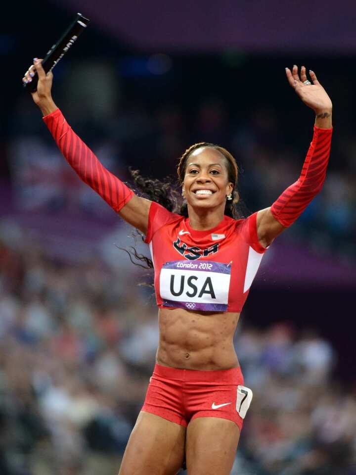 Relay anchor Sanya Richards-Ross of the United States celebrates as the U.S. team won the women's 4 x400 relay to earn a gold medal.