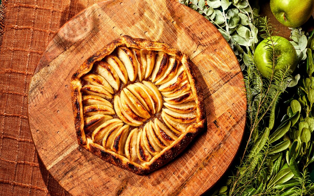Caramelized apple compote and large wedges of fresh apple combine over buttery pastry for this elegant French dessert.