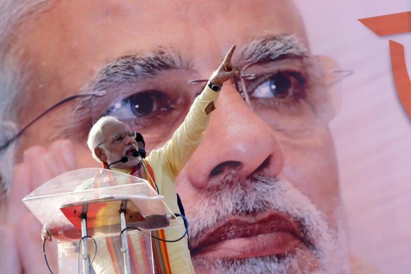 Narendra Modi delivers a speech at a parade ground in Kolkata, India.