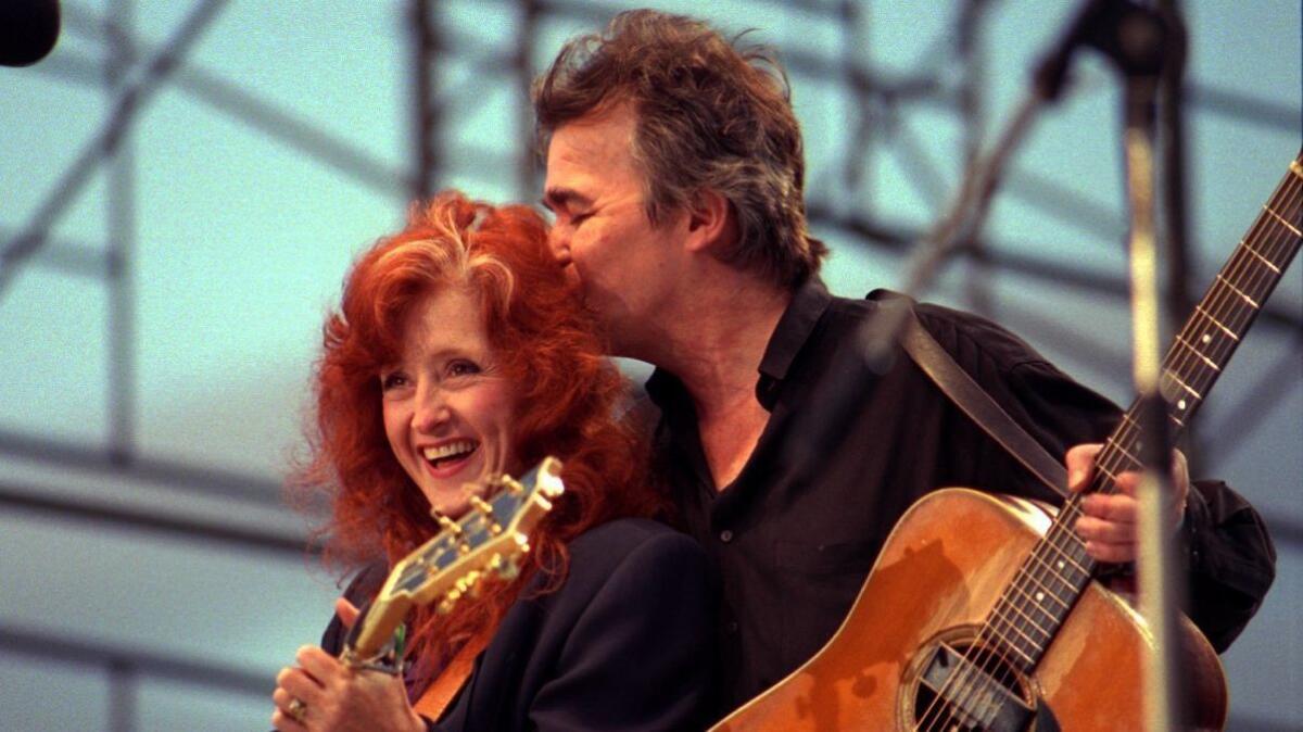 John Prine shares a stage in Westwood in 1996 with Bonnie Raitt, who famously recorded Prine's song "Angel From Montgomery."