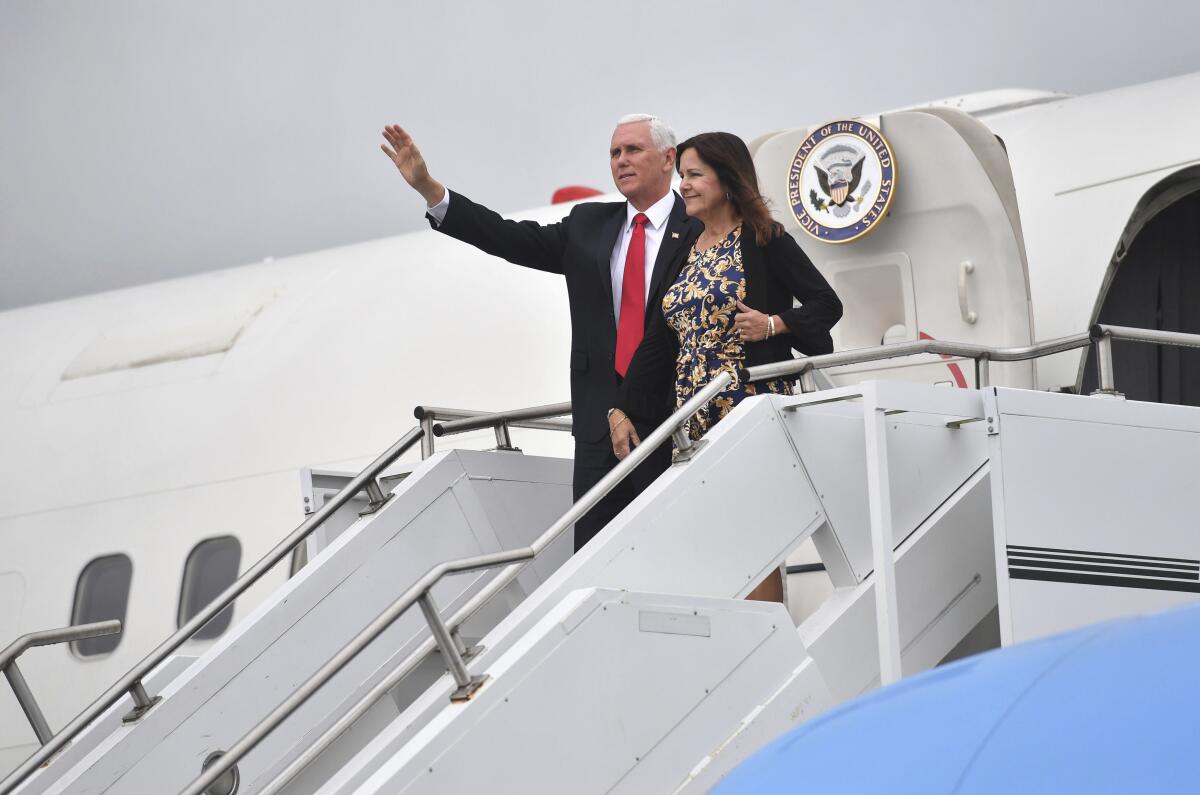 US Vice President Mike Pence and his wife Karen Pence gesture as they arrive at Shannon airport for the start of an official visit to Ireland, Monday, Sept. 2, 2019. (Jacob King/PA via AP)