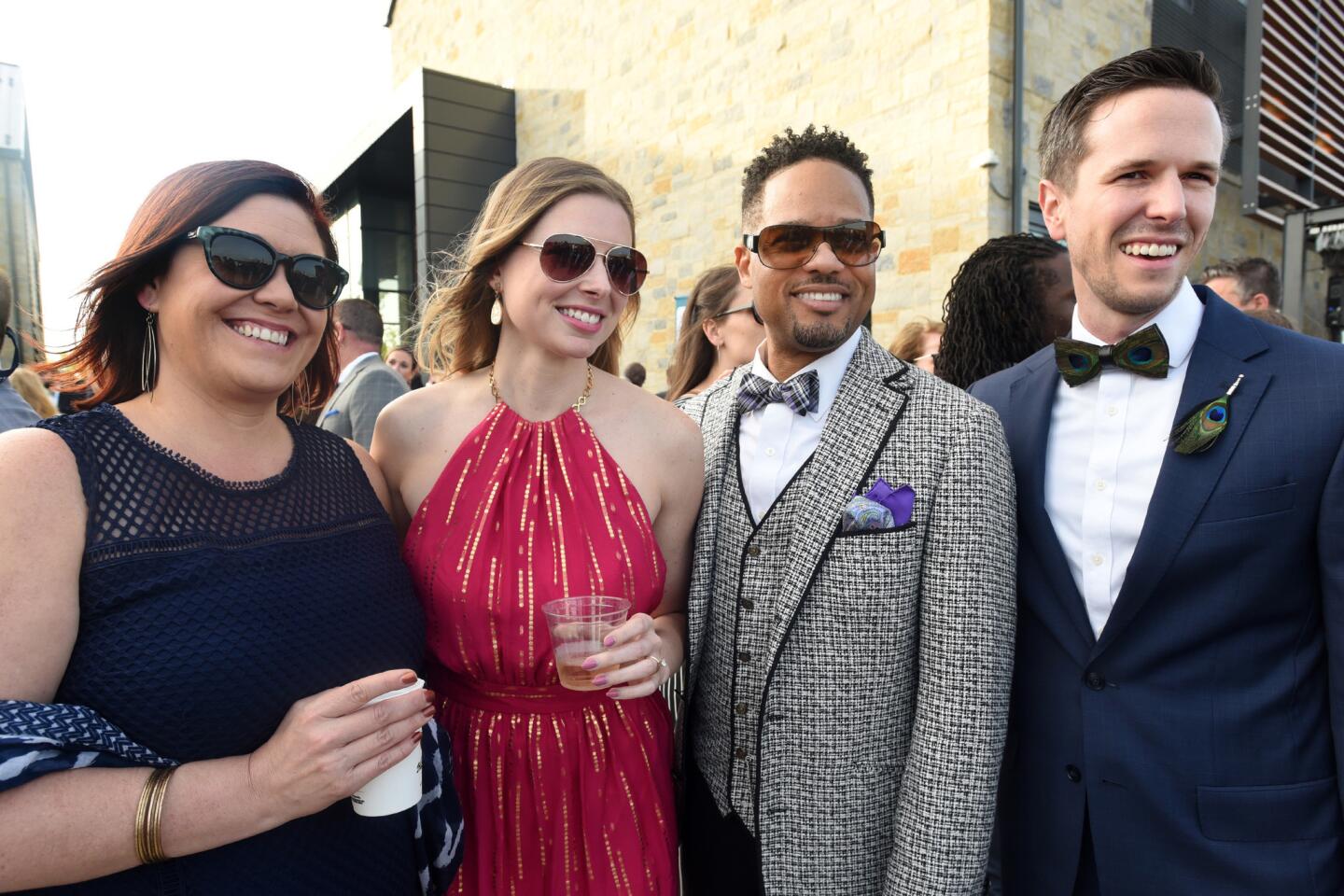 From left, Abby Beck, Amanda Jackson, Earle Bannister and Ryan Uhle at the Bourbon and Bowties charity fundraiser held at Rye Street Tavern in Port Covington.