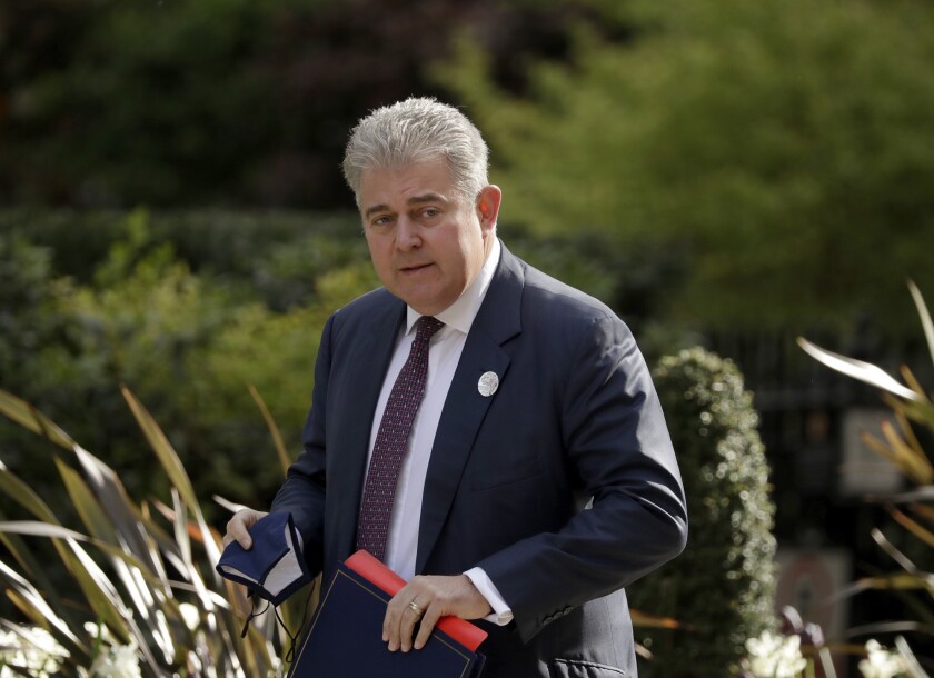 FILE - In this Tuesday, April 27, 2021 file photo, Britain's Northern Ireland Secretary Brandon Lewis walks to 10 Downing Street in London. The U.K. government says it plans to introduce a statute of limitations for alleged crimes committed during decades of violence in Northern Ireland. The move would end prosecution for killings by both British soldiers and militant groups. Northern Ireland Secretary Brandon Lewis told lawmakers in the House of Commons that the statute would “apply equally to all Troubles-related incidents.” More than 3,500 people died during three decades of violence known as the “Troubles,” most of them civilians. (AP Photo/Matt Dunham, File)