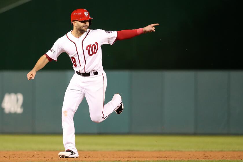 Nationals second baseman Danny Espinosa (8) celebrates after teammate Chris Heisey (not pictured) hits a two-run home run in Game 5 of the National League Division Series on Oct. 13.