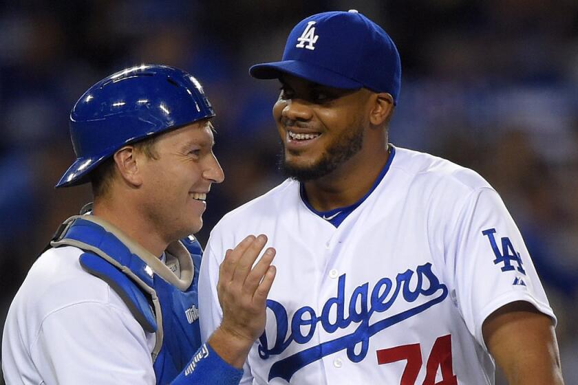 Closer Kenley Jansen, right, and catcher A.J. Ellis celebrate after the Dodgers' 2-0 victory over St. Louis on June 6.