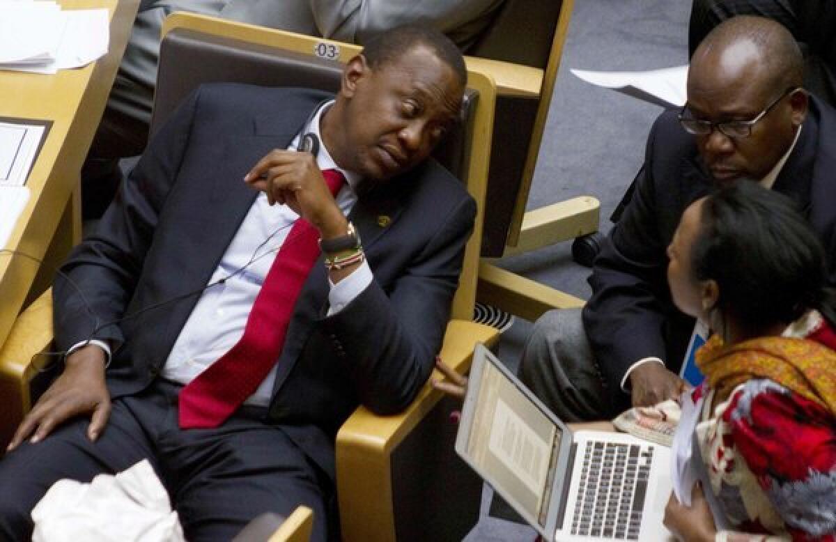 Kenyan President Uhuru Kenyatta, left, at the African Union gathering.