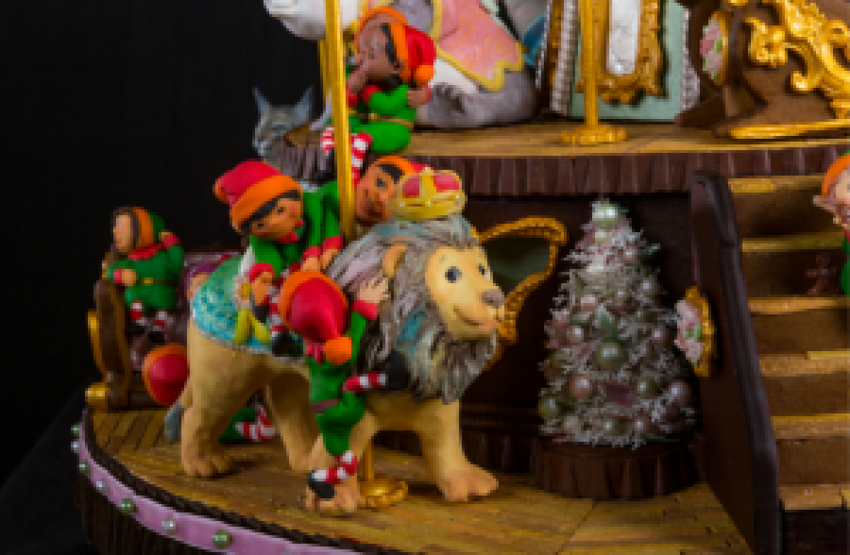 A detail of one of the grand prize-winning carousel animals with mischievous elves.