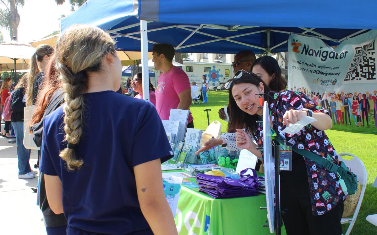 Jennifer Que, a specialist with the Orange County Health Care Agency, at a Vanguard University Wellness Fair Wednesday.