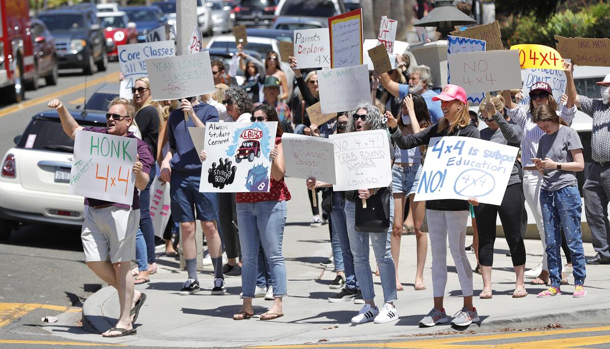 Parents and students demonstrate along Park Avenue outside Laguna Beach High, where they protested against 4x4 learning.