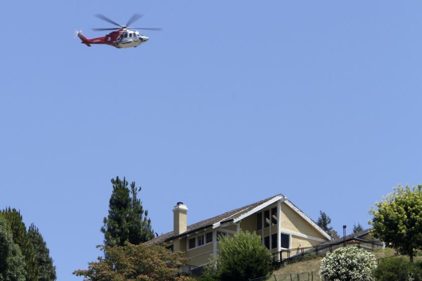 A helicopter flies near the 405 Freeway during the weekend-long road closure in 2011 known as Carmageddon, when helicopters carrying media, tourists and other curiosity seekers hovered for hours over the site.
