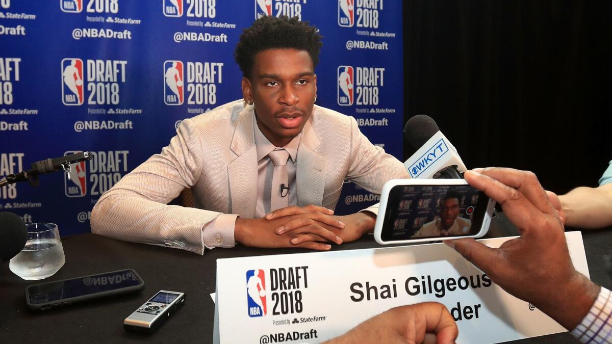 Shai Gilgeous-Alexander addresses members of the media before the NBA draft earlier this week.