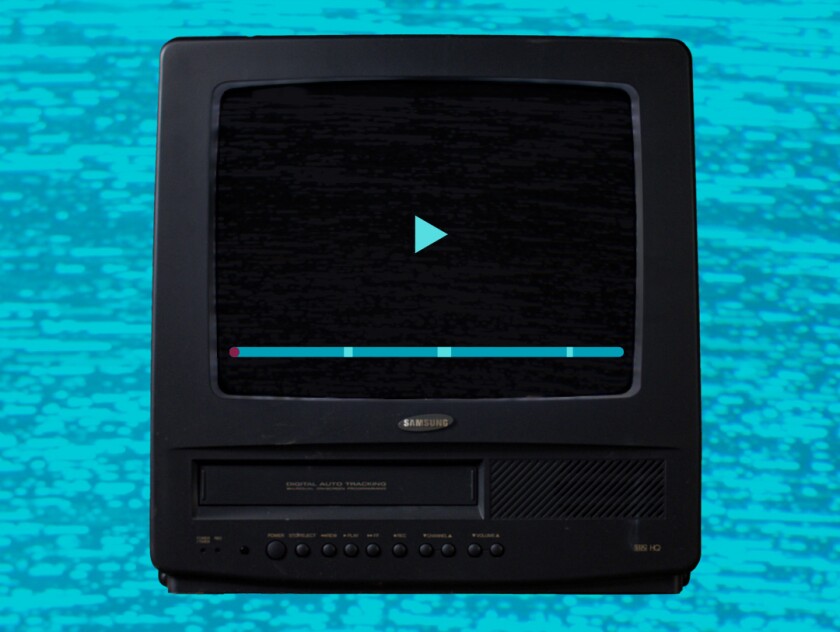 An older model TV set with a play button and progress bar on the screen.