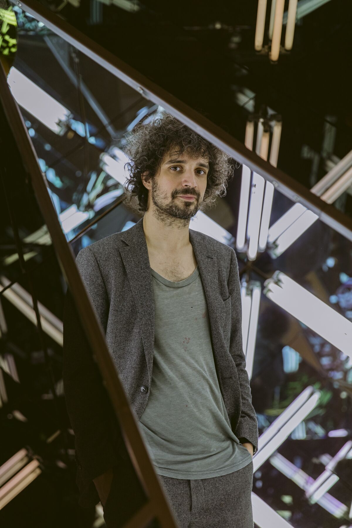 A man seen through a triangular opening
