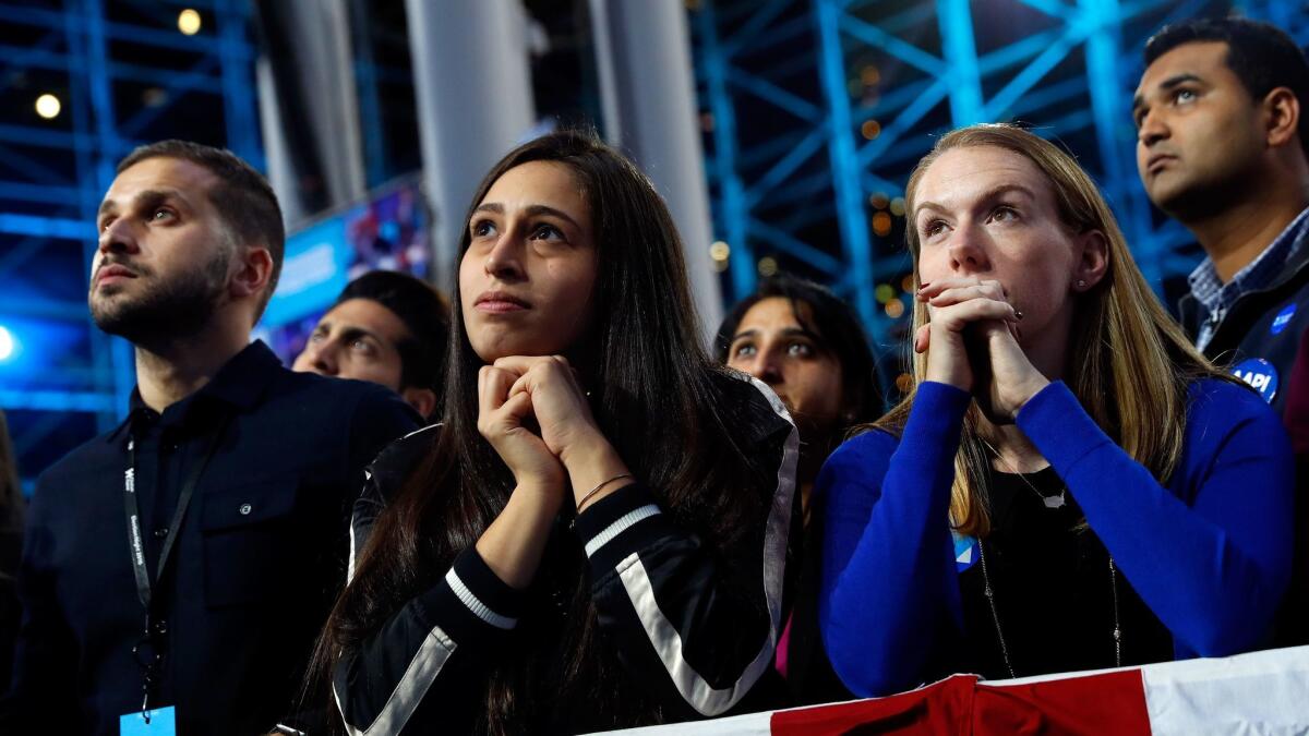 People watch voting results at Democratic presidential nominee former Secretary of State Hillary Clinton's election night event at the Jacob K. Javits Convention Center in New York City.