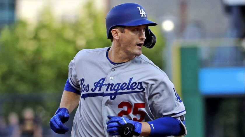 Dodgers' David Freese rounds third after hitting a grand slam off the Pittsburgh Pirates during the first inning in Pittsburgh on May 24.