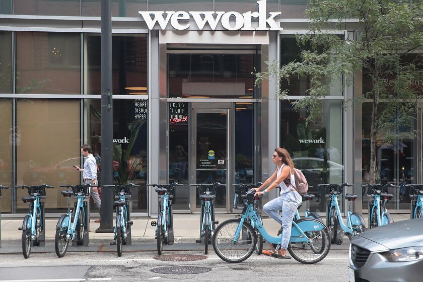 CHICAGO, ILLINOIS - AUGUST 14: A sign marks the location of a WeWork office facility on August 14, 2019 in Chicago, Illinois. WeWork, a real estate firm that leases shared office space, announced today that it had filed a financial prospectus with regulators to become a publicly traded company. (Photo by Scott Olson/Getty Images)