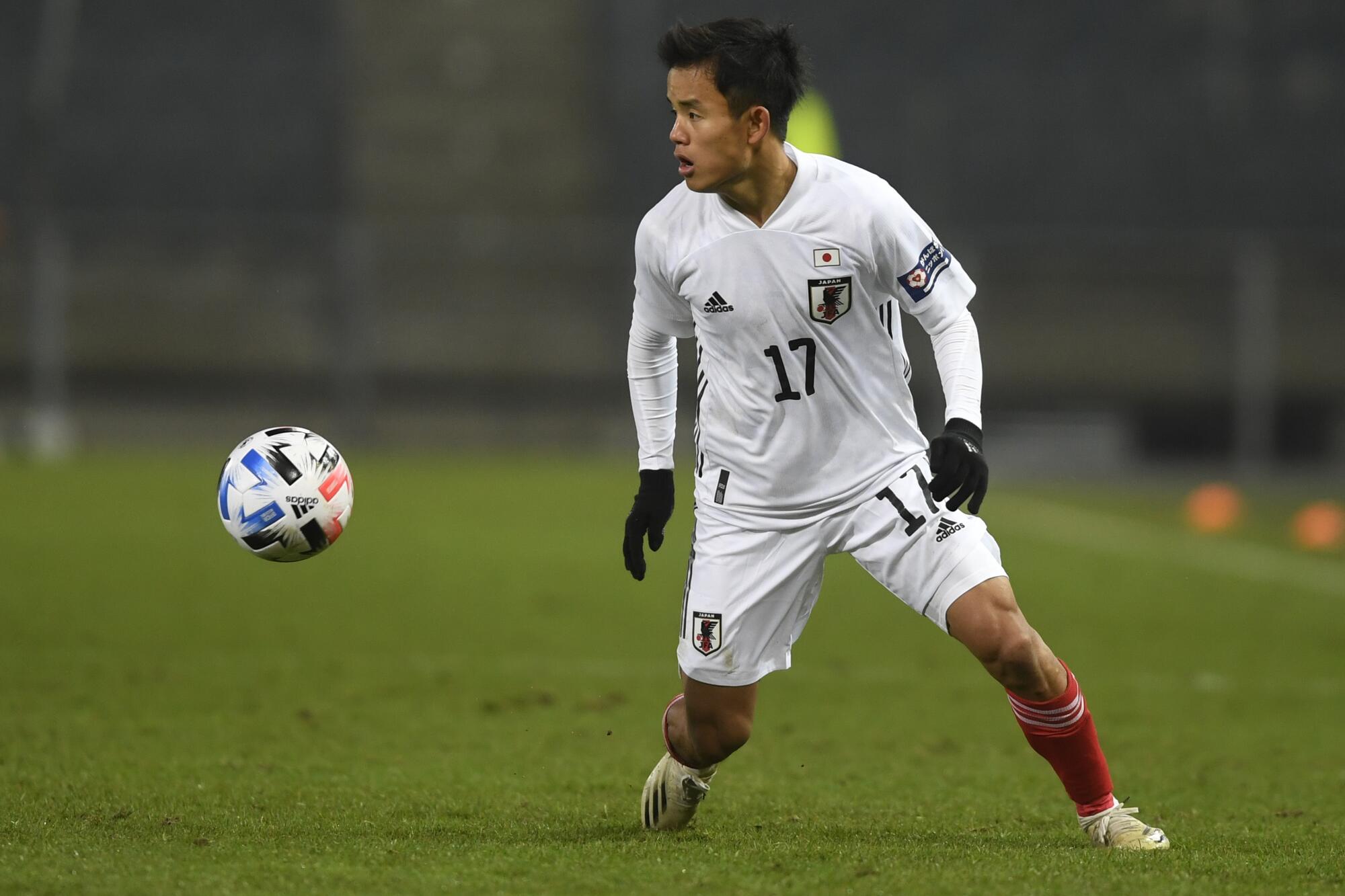 Japan's Takefusa Kubo controls the ball during the international friendly soccer match 