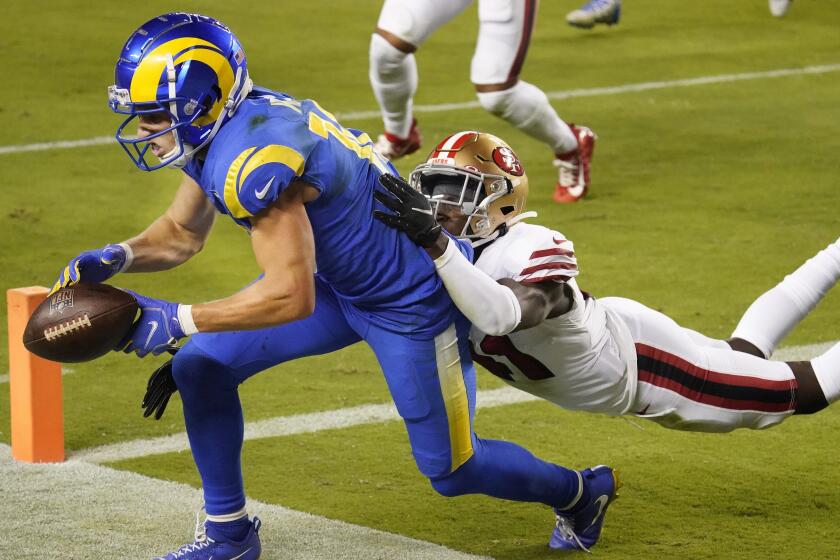 Los Angeles Rams wide receiver Cooper Kupp, left, cannot catch a pass in the end zone.