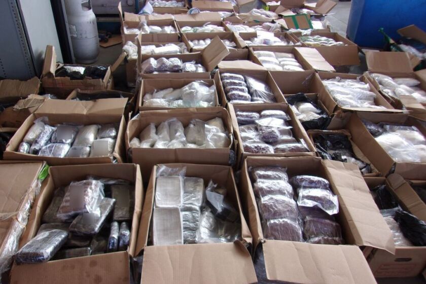Customs and Border Protection officers found bundles of meth, fentanyl and heroin in a semi-trailer in Otay Mesa on Friday.